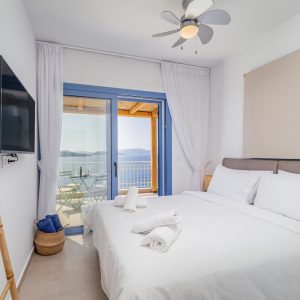 blue-lefkada-luxury-apartments-bedroom-blue-window-fan copy